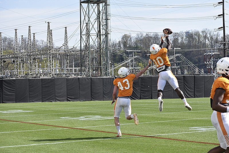 Tennessee defensive back Tyler Byrd (10) leaps for an interception during practice on April 3. Byrd has spent time in the secondary this spring, but first-year Vols coach Jeremy Pruitt and his staff had moved Byrd back to wide receiver on Tuesday.