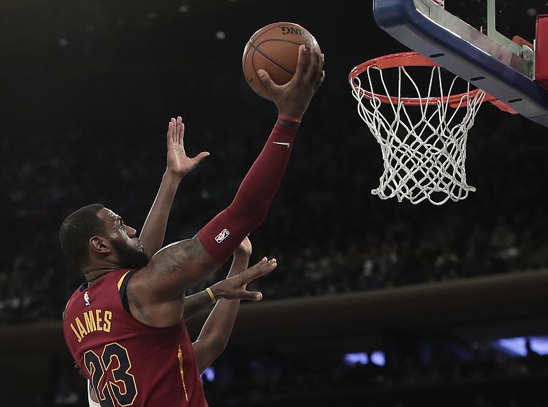 Cleveland Cavaliers forward LeBron James (23) puts up a shot against the New York Knicks during the second quarter of an NBA basketball game, Monday, April 9, 2018, in New York. The Cavaliers won 123-109. (AP Photo/Julie Jacobson)