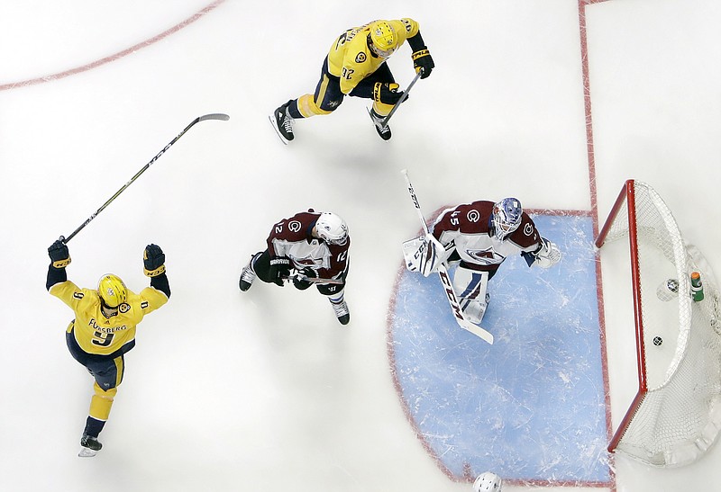 Nashville Predators left wing Filip Forsberg (9), of Sweden, celebrates after scoring a goal against Colorado Avalanche goaltender Jonathan Bernier during the third period in Game 1 of an NHL hockey first-round playoff series Thursday, April 12, 2018, in Nashville, Tenn. (AP Photo/Mark Humphrey)