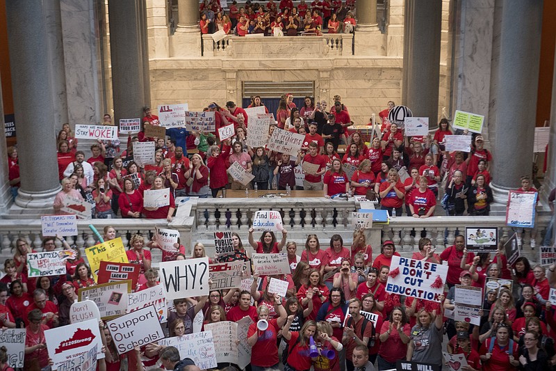 Teachers from across Kentucky gather inside the state Capitol to rally for increased funding and to protest changes to their state funded pension system, Friday, April 13, 2018, in Frankfort, Ky. (AP Photo/Bryan Woolston)

