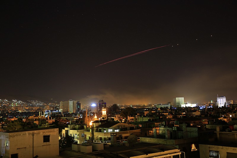 Explosions lit up the skies with anti-aircraft fire, over Damascus, the Syrian capital, as the U.S. launches an attack on Syria targeting different parts of the Syrian capital Damascus, Syria, early Saturday, April 14, 2018. 