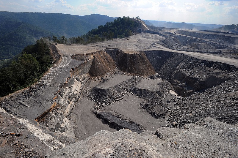 In this 2008 file photo, a mountaintop removal strip mining site at Kayford Mountain, W.Va., is shown with Coal River Mountain, left, in the background. (AP Photo/Jeff Gentner, File)
