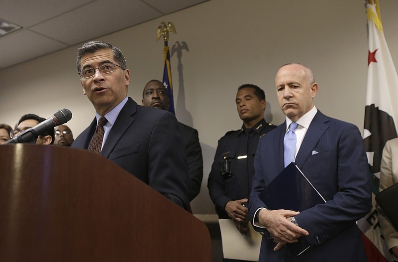 California Attorney General Xavier Becerra, left, and other lawmakers have led the Golden State to spending 100 billion more than it takes in tax revenue.