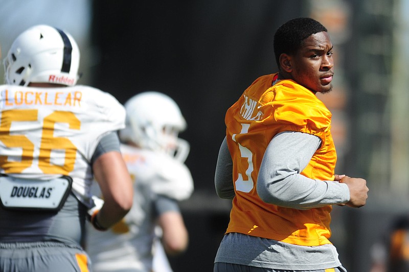 In this April 4, 2018 photo, Tennessee defenseman Kyle Phillips, right, runs on the field during NCAA college football practice in Knoxville, Tenn. New Tennessee coach Jeremy Pruitt's background suggests the Volunteers eventually should have a major improvement from their defense. How long that process will take remains up in the air as Tennessee adapts to the 3-4 scheme preferred by Pruitt, a former Alabama defensive coordinator. (Calvin Mattheis/Knoxville News Sentinel via AP)