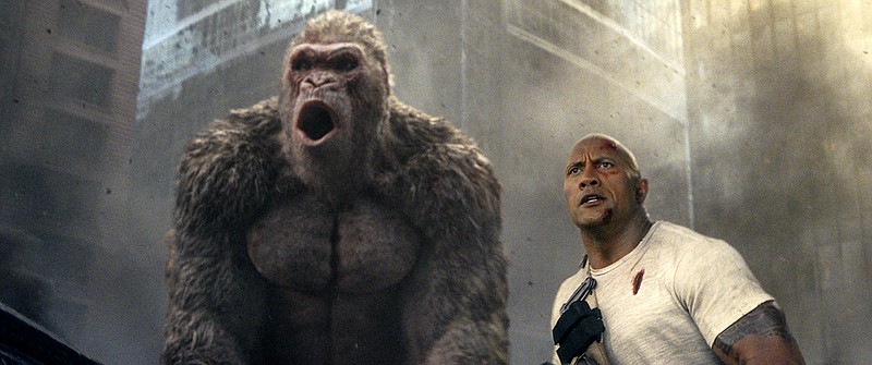 This image released by Warner Bros. shows Dwayne Johnson in a scene from "Rampage." Johnson's arcade game-inspired "Rampage" crept past last week's top film "A Quiet Place" to take the No. 1 spot on the box office charts. (Warner Bros. via AP)