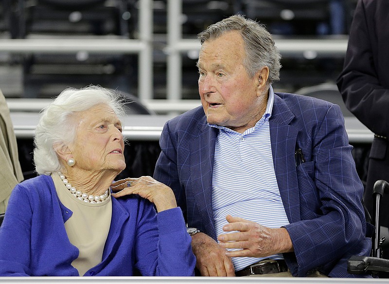 In this March 29, 2015, file photo, former President George H.W. Bush and his wife Barbara Bush, left, speak before a college basketball regional final game between Gonzaga and Duke, in the NCAA basketball tournament in Houston. A family spokesman said Sunday, April 15, 2018, that the former first lady Barbara Bush is in "failing health" and won't seek additional medical treatment. (AP Photo/David J. Phillip, File)