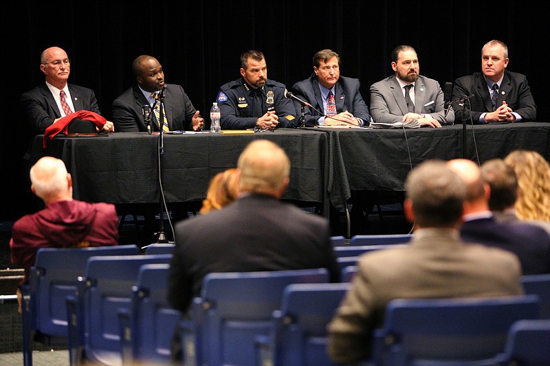 A group of panelists listen as a question is asked during a Town Hall meeting held Monday, April 16, 2018, at East Hamilton Middle High School in Ooltewah, Tenn. Sheriff Jim Hammond, seated on the far left of the panelists, and the Professional Educators of Tennessee joined together to host the event.