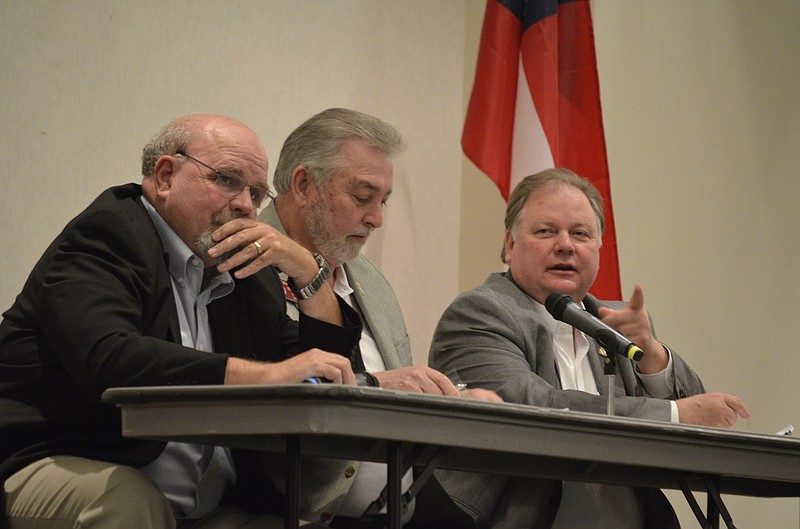 Georgia state Reps, Steve Tarvin and Dewayne Hill sit alongside state Sen. Jeff Mullis during a Catoosa County Chamber of Commerce luncheon April 12. The lawmakers provided updates on bills approved during Georgia's 2018 legislative session, including one that places stricter restrictions on distracted driving.