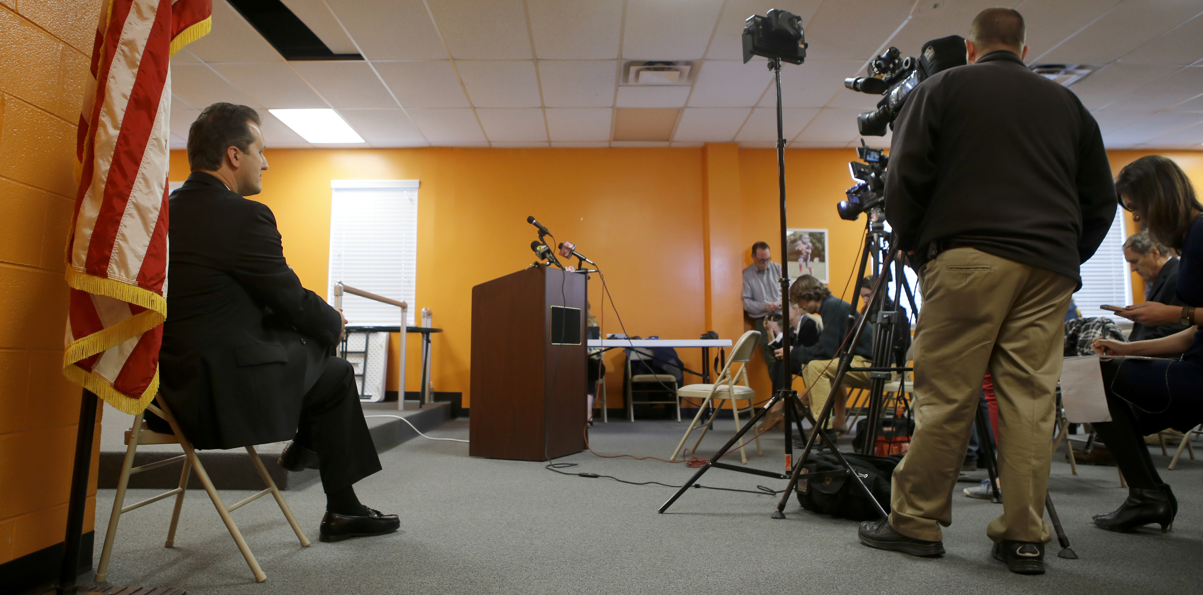 East Ridge Mayor and District 8 county commissioner candidate Brent Lambert, left, looks on as the first recorded phone call with incumbent Tim Boyd is played for the media in The Orange Room at the East Ridge Community and Senior Center on Monday, April 16, 2018 in East Ridge, Tenn. Tim Boyd was indicted for extortion.