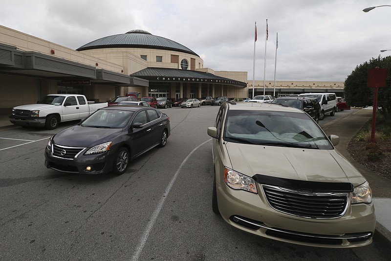 Staff file photo / Vehicles fill the front of the Chattanooga Metropolitan Airport. Passenger traffic dropped last month for the first time in a year and a half, but officials predict growth as the year continues.