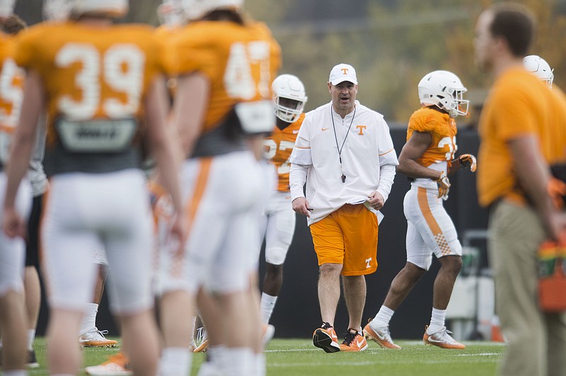 In this March 27, 2018, photo, Tennessee head coach Jeremy Pruitt walks on the field during an NCAA college football practice in Knoxville, Tenn. (Caitie McMekin/Knoxville News Sentinel via AP)