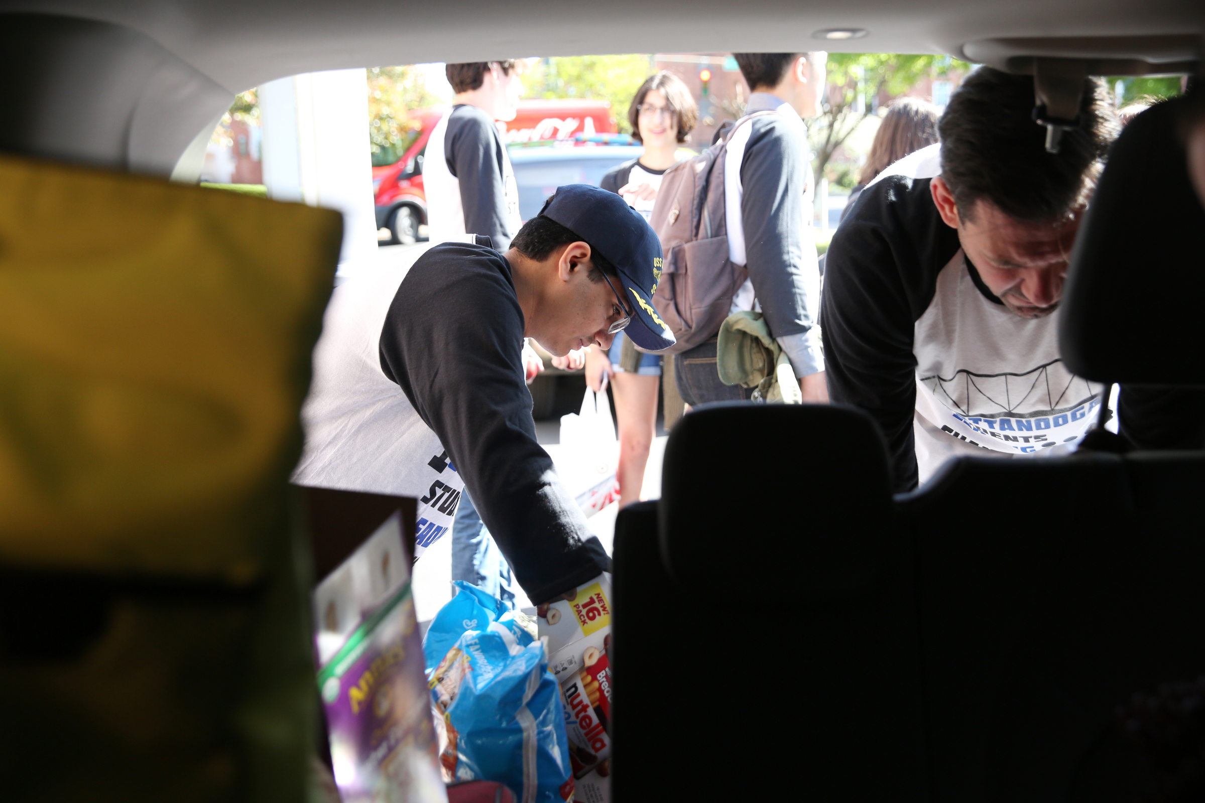 Krishna Chanamolu, 16, helps organize snacks Wednesday, April 18, 2018 at First Christian Church in Chattanooga, Tenn. Chanamolu is part of a group of students from various high schools around Chattanooga that is heading to Washington D.C. to meet with Senator Bob Corker and other federal lawmakers about school safety.