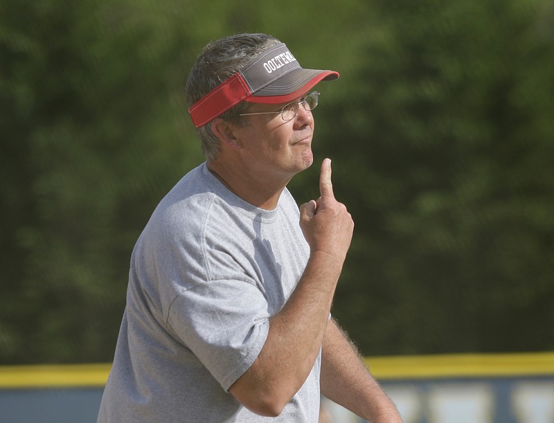 Ooltewah softball coach Jon Massey signals to a runner during Wednesday's District 5-AAA game at Walker Valley in Charleston, Tenn.