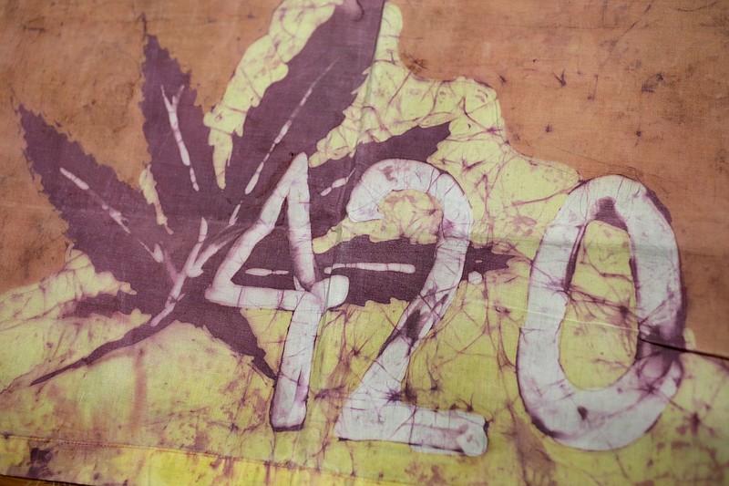 This Friday, April 13, 2018, photo, shows a Waldos 420 flag from 1972 made by a classmate at San Rafael High School, at a bank vault in San Francisco. Friday is April 20, or 4/20. That's the numerical code for marijuana's high holiday, a celebration and homage to pot's enduring and universal slang for smoking. And five Northern California high school stoner buddies widely credited with creating the shorthand slang for getting high nearly 50 years ago now serve as the day's unofficial grand masters. (AP Photo/Eric Risberg)