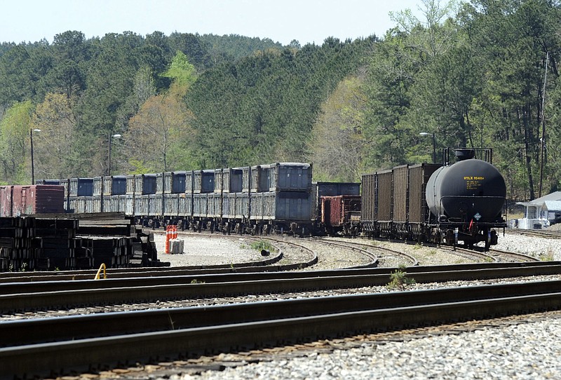 This April 12, 2018 photo shows containers that were loaded with tons of sewage sludge in Parrish, Ala. More than two months after the so-called "Poop Train" rolled in from New York City, Hall says her small town smells like rotting corpses. Some say the trainloads of New Yorkers' excrement is turning Alabama into a dumping ground for other states' waste. (AP Photo/Jay Reeves)

