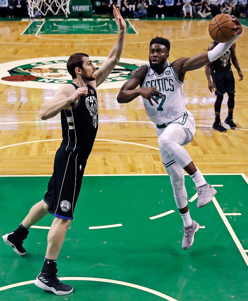 Boston Celtics guard Jaylen Brown (7) drives to the basket against Milwaukee Bucks center Tyler Zeller, left, during the first quarter of Game 2 of an NBA basketball first-round playoff series in Boston, Tuesday, April 17, 2018. (AP Photo/Charles Krupa)