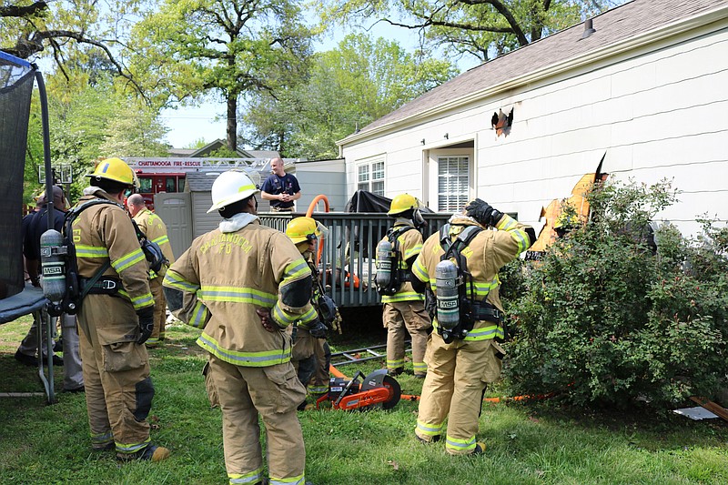 Chattanooga firefighters respond to a house fire in the 900 block of Linden Avenue on Wednesday, April 18, 2018.