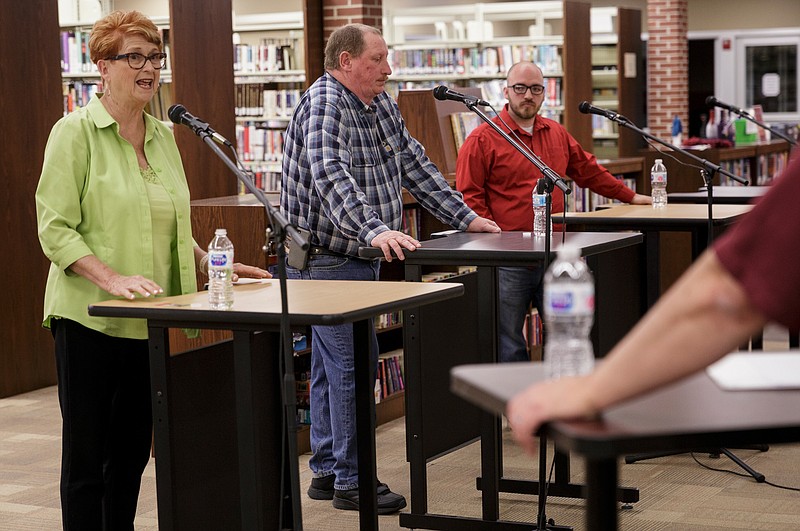 Dade County Commission District 1 candidates Jane Dixon, left, Lamar Lowery, center, and Patrick Hickey answer questions during a debate at Dade County Public Library on Thursday, April 19, 2018, in Trenton, Ga. Multiple candidates across several races were in attendance for the forum, which precedes the May 22 primary election.