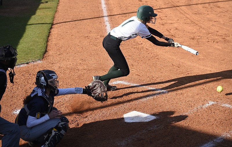 Staff Photo by Robin Rudd Silverdale's Marlee Montgomery (1) lays down a bunt for a hit. The Chattanooga Christian Chargers visited the Silverdale Academy Seahawks in TSSAA softball action on April 19, 2018
