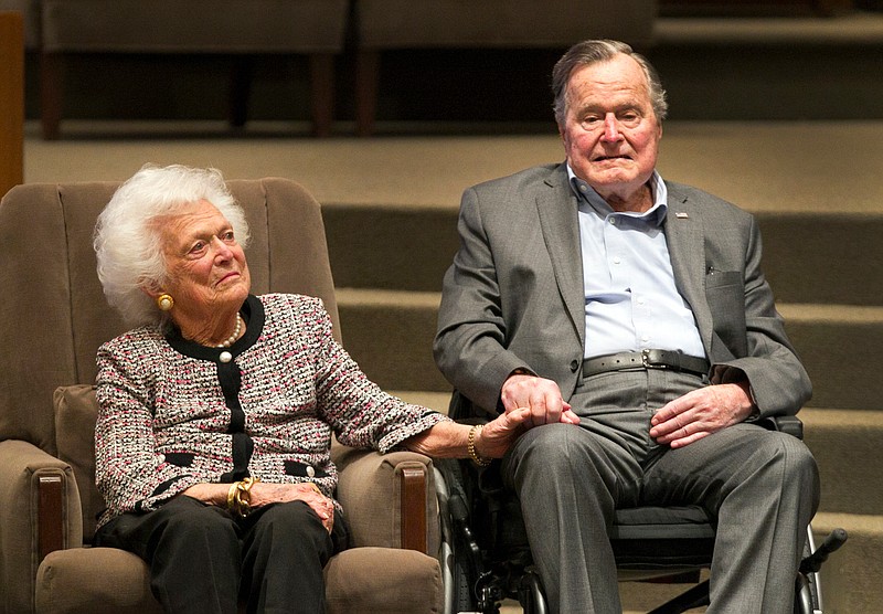 FILE - In this March 8, 2017, file photo, the Mensch International Foundation presented its annual Mensch Award to former U.S. President George H.W. Bush and former first lady Barbara Bush at an awards ceremony hosted by Congregation Beth Israel in Houston. A family spokesman said Tuesday, April 17, 2018, that former first lady Barbara Bush has died at the age of 92. ( Steve Gonzales/Houston Chronicle via AP, File)