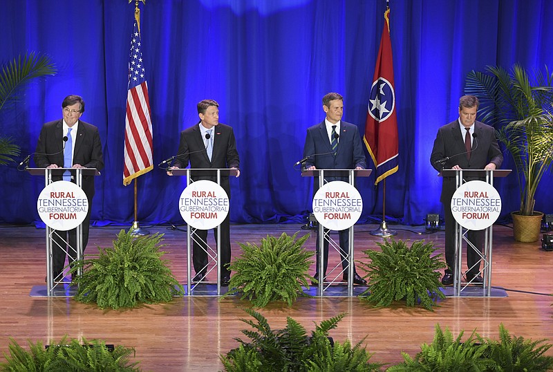 Candidates Craig Fitzhugh, from left, Randy Boyd, Bill Lee, and Karl Dean participate in the Rural Tennessee Gubernatorial Forum, Tuesday, April 17, 2018, at Lane College, in Jackson, Tenn. The candidates answered questions from education to the urban-rural divide. (Kenneth Cummings/The Jackson Sun via AP)