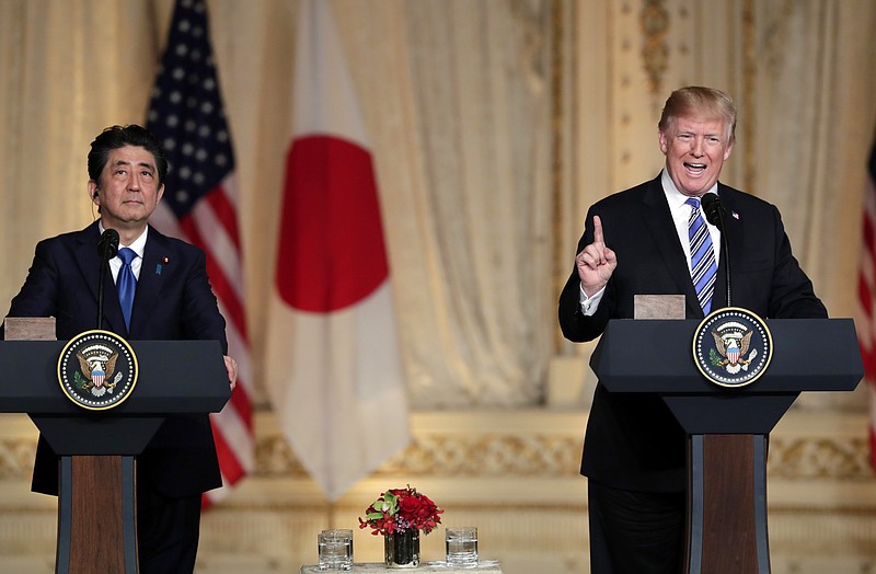 Japanese Prime Minister Shinzo Abe, left, listens as President Donald Trump speaks during a news conference at Trump's private Mar-a-Lago club, Wednesday, April 18, 2018, in Palm Beach, Fla. (AP Photo/Lynne Sladky)