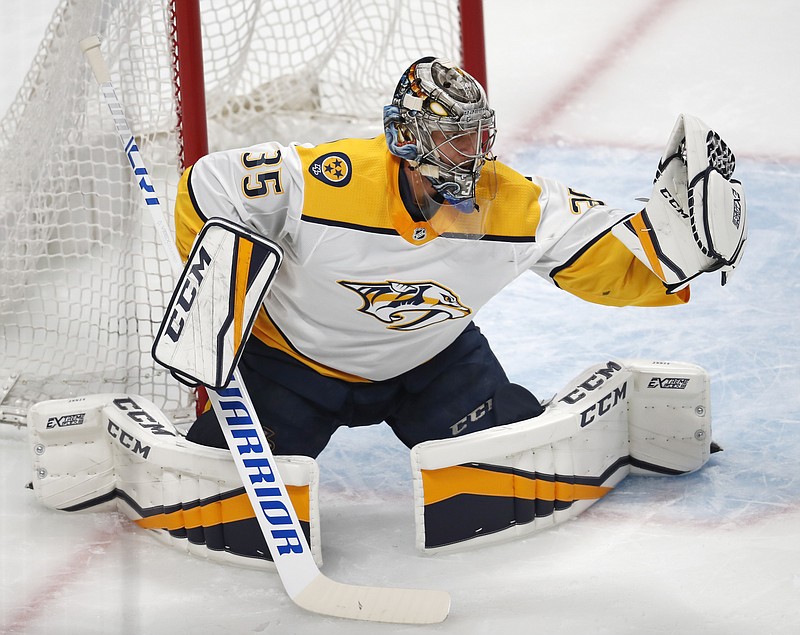 Nashville Predators goaltender Pekka Rinne makes a glove save against the Colorado Avalanche during the first period of Game 4 of an NHL hockey first-round playoff series Wednesday, April 18, 2018, in Denver. (AP Photo/David Zalubowski)