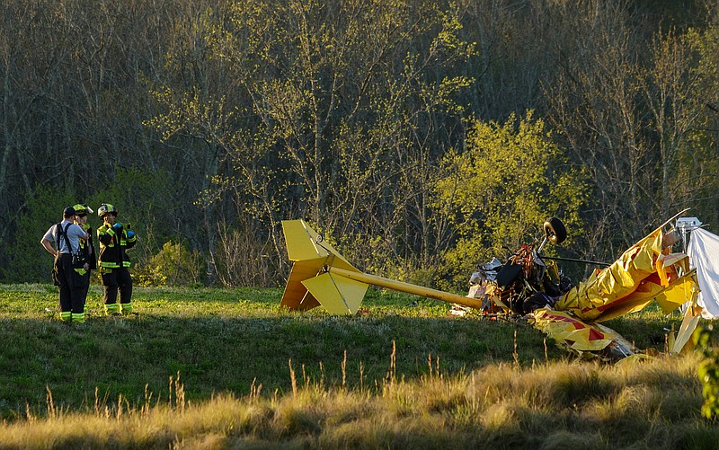 Staff photo by Doug Strickland / 
Emergency crews investigate a small-engine plane crash at the Collegedale Municipal Airport on Friday, April 20, 2018, in Collegedale, Tenn. 