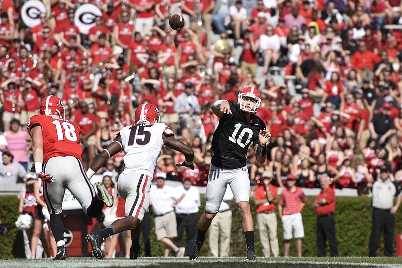 Tight end Isaac Nauta (18), outside linebacker D'Andre Walker (15) and then-quarterback Jacob Eason (10) compete during Georgia's G-Day spring game in 2016, which set an SEC attendance record with 93,000 fans.