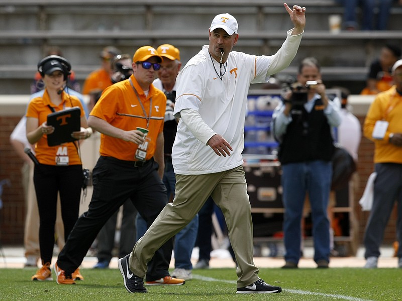 Tennessee head coach Jeremy Pruitt signals for the teams to head to the locker room after the Orange and White spring game at Neyland Stadium on Saturday, April 21, 2018 in Knoxville, Tenn.