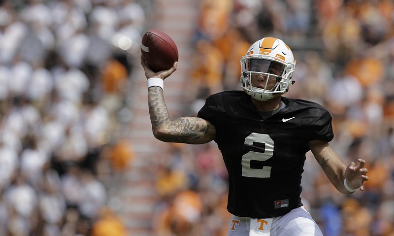 Orange team quarterback Jarrett Guarantano (2) throws on the run during the Orange and White spring game at Neyland Stadium on Saturday, April 21, 2018 in Knoxville, Tenn.