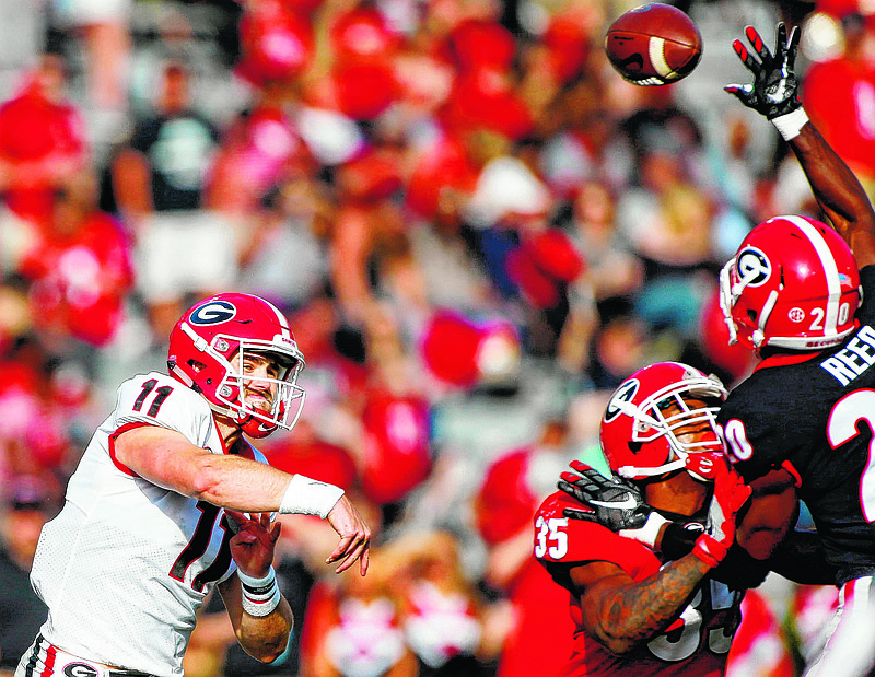 Georgia defensive back J.R. Reed (20) blocks a pass from Georgia quarterback Jake Fromm (11) during a spring NCAA college football G-Day game in Athens, Ga., Saturday, April 21, 2018. (Joshua L. Jones/Athens Banner-Herald via AP)