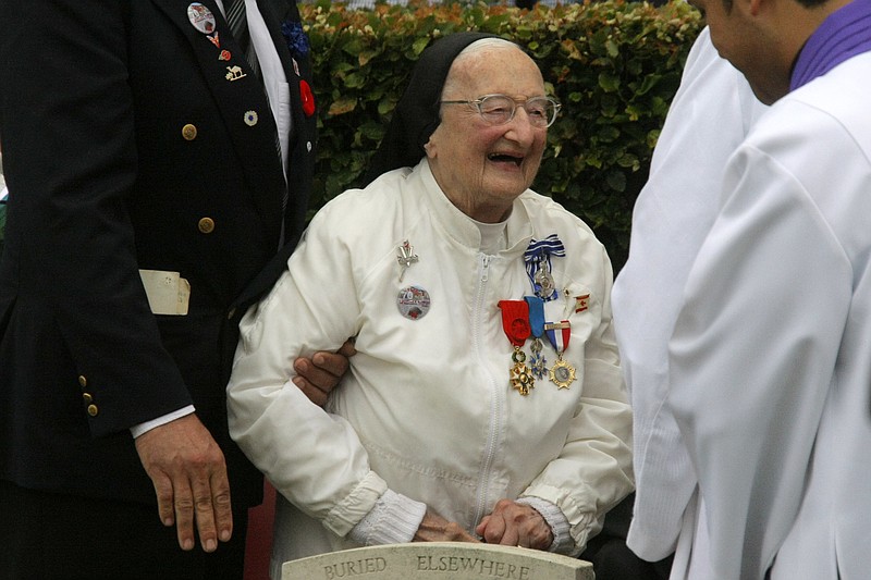 
              FILE - In this Sunday Aug. 19, 2012 file photo, Sister Agnes-Marie Valois attends the commemorations to honor Allied soldiers killed 70 years ago in a failed World War II invasion, which took place at the Cemetery of Virtues in Dieppe, northern France. French authorities say the 103-year-old nun known as the “White Angel” who helped allied soldiers during a failed World War II raid has died. The city of Dieppe in Normandy says a tribute to Sister Agnes-Marie Valois will be held on April 24, 2018 at the Canadian cemetery. (AP Photo/Michel Spingler, File)
            