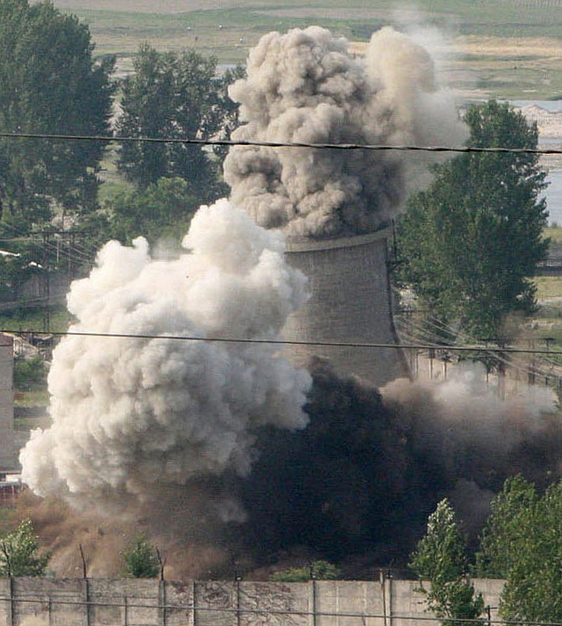 FILE - In this June 27, 2008 file photo released by China's Xinhua News Agency, the cooling tower of the Nyongbyon nuclear complex is demolished in Nyongbyon, also known as Yongbyon, North Korea.
