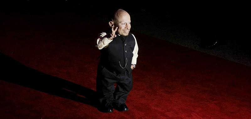 File-This Oct. 6, 2009, file photo shows cast member Verne Troyer posing for photographs as he arrives at the gala premiere of the film "The Imaginarium of Doctor Parnassus" at a cinema in London. 