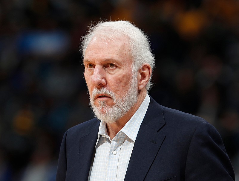 
              FILE - In this Feb. 23, 2018, file photo, San Antonio Spurs head coach Gregg Popovich watches in the second half of an NBA basketball against the Denver Nuggets, in Denver. The NBA is paying tribute to the wife of San Antonio Spurs coach Gregg Popovich. Erin Popovich died Wednesday, April 18, 2018,  at 67, the team said. Her death came after a long illness, the San Antonio Express-News reported. (AP Photo/David Zalubowski, File)
            