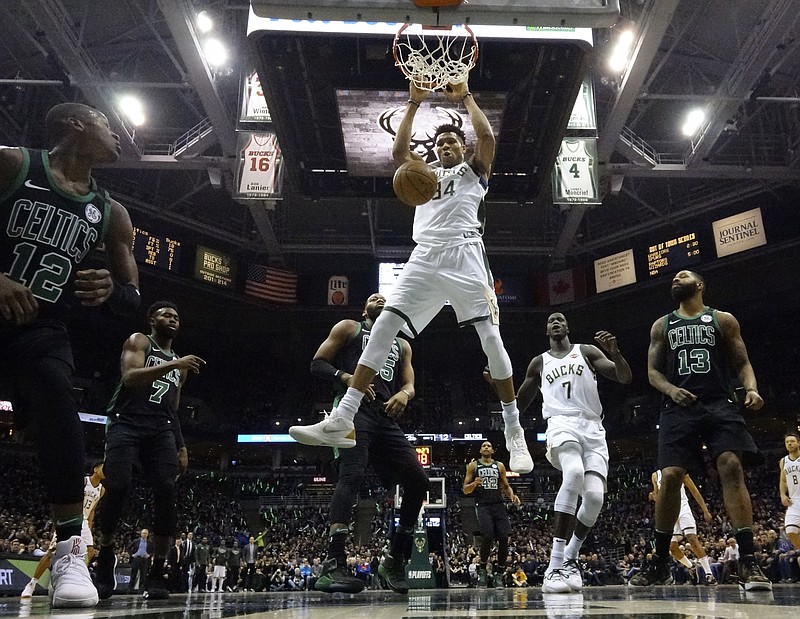 Milwaukee Bucks' Giannis Antetokounmpo dunks during the first half of Game 4 of an NBA basketball first-round playoff series against the Boston Celtics Sunday, April 22, 2018, in Milwaukee. (AP Photo/Morry Gash)