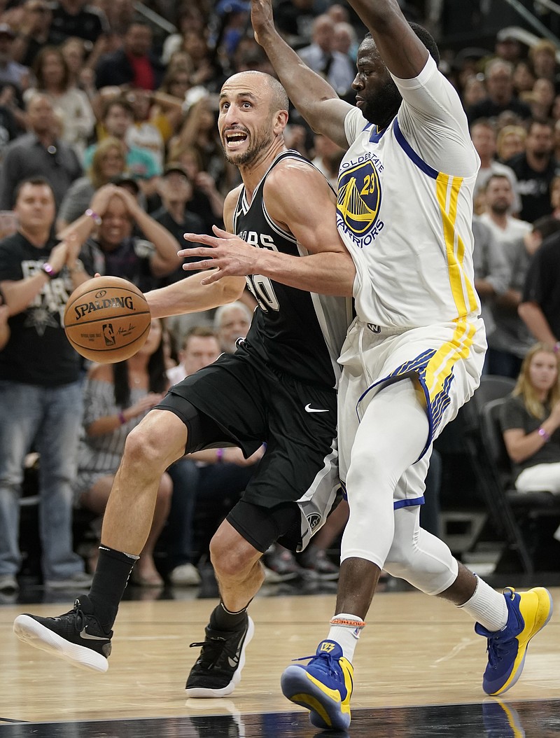 San Antonio Spurs' Manu Ginobili, left, drives against Golden State Warriors' Draymond Green during the second half of Game 4 of a first-round NBA basketball playoff series in San Antonio, Sunday, April 22, 2018, in San Antonio. San Antonio won 103-90. (AP Photo/Darren Abate)