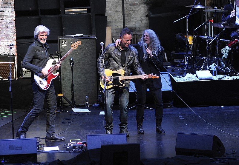 
              Bruce Springsteen, center, and Patti Smith, right, perform after a special screening of "Horses: Patti Smith and Her Band" at the Beacon Theatre during the 2018 Tribeca Film Festival, on Monday, April 23, 2018, in New York. (Photo by Brad Barket/Invision/AP)
            