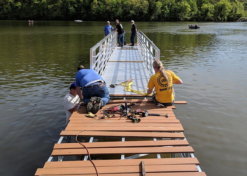 Union volunteers installed a new 104-foot-long, handicap-accessible floating pier at Wolftever Creek on April 21 to make the boat dock accessible year round. (Contributed photo by Union Sportsmen's Alliance)