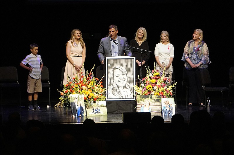Michael Riordan, center, is joined by family members at a memorial service for his wife Jennifer Riordan, who died on Tuesday in the Southwest Airlines flight 1380 accident, at Popejoy Hall on the campus of the University of New Mexico in Albuquerque, N.M., Sunday, April 22, 2018. (Adolphe Pierre-Louis/The Albuquerque Journal via AP)