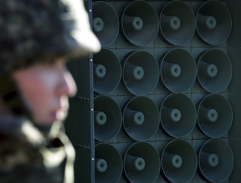  In this Jan. 8, 2016 file photo, a South Korean soldier stands near the loudspeakers near the border area between South Korea and North Korea in Yeoncheon, South Korea. South Korea says it has halted anti-Pyongyang propaganda broadcasts on the border ahead of the April 27, 2018, inter-Korean talks. The South's Defense Ministry says it turned off loudspeaker broadcasts Monday, April 23, to try to ease military tensions and establish an environment for peaceful talks. South Korea had broadcast anti-North propaganda across the border since the North's fourth nuclear test in early 2016. (Lim Tae-hoon/Newsis via AP, File)