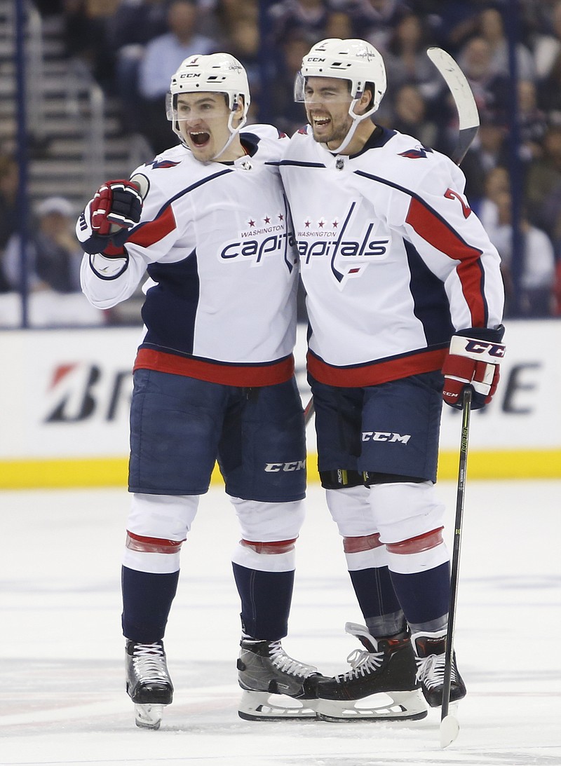 Washington Capitals' Dmitry Orlov, left, of Russia, celebrates his goal against the Columbus Blue Jackets with teammate Matt Niskanen during the first period of Game 6 of an NHL first-round hockey playoff series Monday, April 23, 2018, in Columbus, Ohio. (AP Photo/Jay LaPrete)