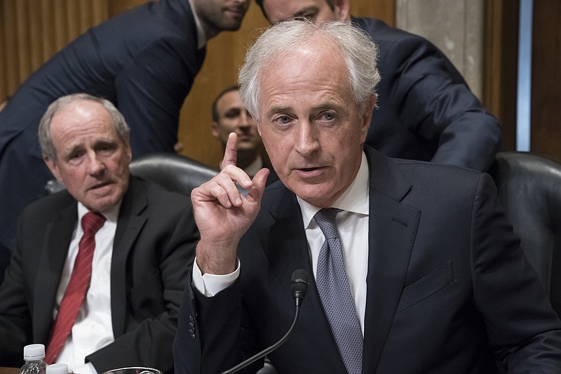 
              Sen. Jim Risch, R-Idaho, left, and Senate Foreign Relations Committee Chairman Bob Corker, R-Tenn., listen to comments during maneuvering on the confirmation vote for President Donald Trump's nominee for secretary of state, Mike Pompeo, who has faced considerable opposition before the panel, on Capitol Hill in Washington, Monday, April 23, 2018. (AP Photo/J. Scott Applewhite)
            