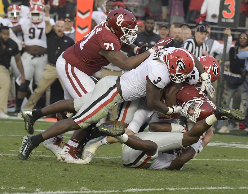 Former Georgia inside linebacker Roquan Smith (3), shown helping sack Oklahoma's Baker Mayfield in the Rose Bowl on New Year's Day, has been projected as a top-10 pick in this year's NFL draft, which starts Thursday night.