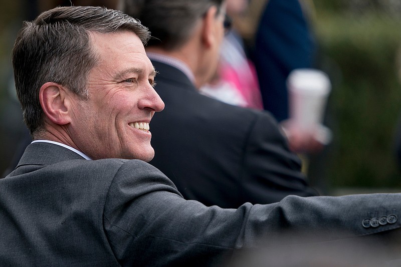 In this April 2, 2018, file photo, White House physician and nominee for Veterans Affairs Secretary Dr. Ronny Jackson arrives at the annual White House Easter Egg Roll on the South Lawn of the White House in Washington. Now it's Washington's turn to examine Jackson. The doctor to Presidents George W. Bush, Barack Obama and now Donald Trump is an Iraq War veteran nominated to head the Department of Veterans Affairs. (AP Photo/Andrew Harnik, File)