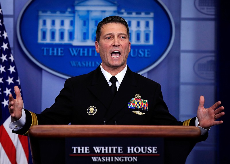 In this Jan. 16, 2018, file photo, White House physician Dr. Ronny Jackson speaks to reporters during the daily press briefing in the Brady press briefing room at the White House, in Washington. Now it's Washington's turn to examine Jackson. The doctor to Presidents George W. Bush, Barack Obama and now Donald Trump is an Iraq War veteran nominated to head the Department of Veterans Affairs. (AP Photo/Manuel Balce Ceneta, File)