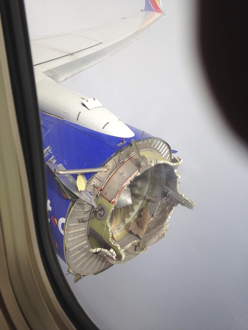FILE - This Aug. 27, 2016, file photo shows an engine through a window of a Southwest Airlines flight. 