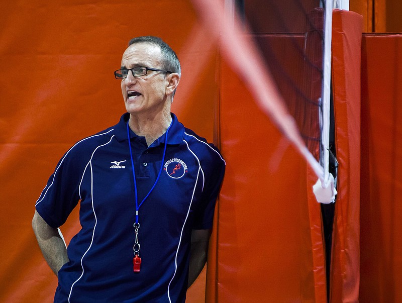 In this Aug. 4, 2014, photo, Rick Butler, a nationally renowned volleyball coach from Chicago, watches a scrimmage during the first day of a volleyball camp at Abbott Sports Complex in Lincoln, Neb. Michigan State University has maintained ties to Butler for decades after he was publicly accused in 1995 of sexually abusing and raping six underage girls he trained in the 1980s. Letters obtained by The Associated Press from accusers' advocates show the school has been under pressure since at least 