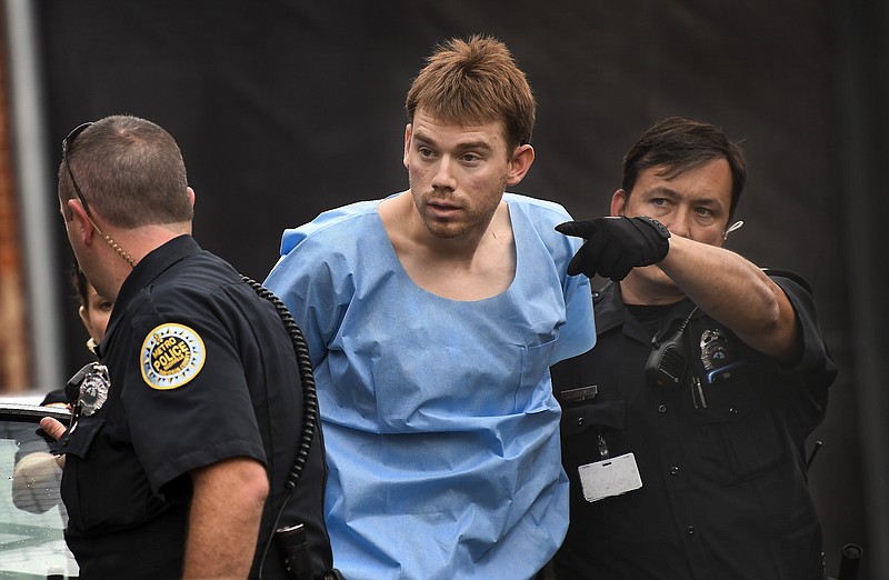 In this Monday, April 23, 2018 photo, Travis Reinking, suspected of killing four people in a late-night shooting at a Waffle House restaurant, is escorted into the Hill Detention Center in Nashville, Tenn., Monday, April 23, 2018. (Lacy Atkins/The Tennessean via AP)

